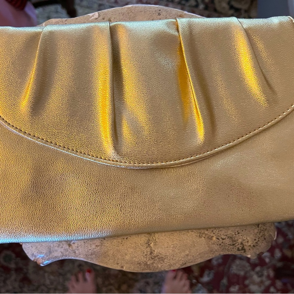 Small gold clutch. Perfect accessory for a formal occasion